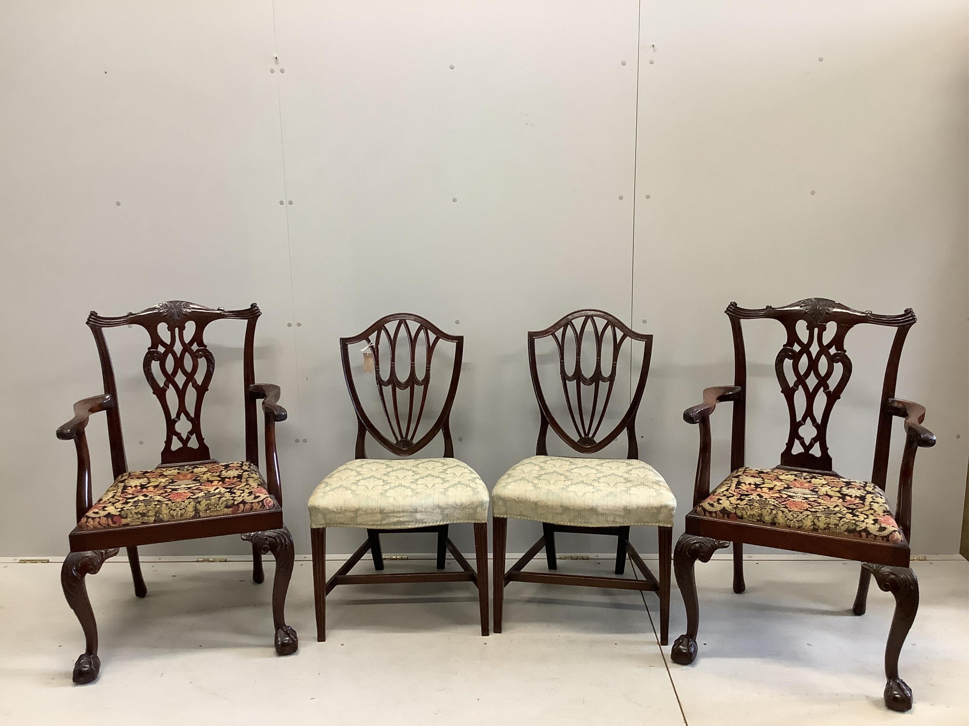 A pair of George III Sheraton style mahogany dining chairs and a pair of George III style mahogany elbow chairs. Condition - good